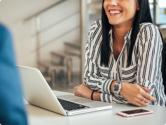 Person at a desk with a laptop