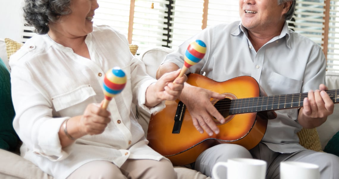 Superannuation-senior-couple-having-fun-with-singing-playing-guitar.jpg